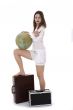 Young woman with  suitcase and globe