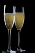 Two glasses champagne on black closeup