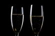 Two glasses champagne on black macro