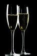 Two glasses champagne on black