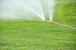 Sprinkling on grass from damaged hose