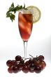 champagne glasses with red grapes
