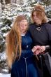 Two ladies in winter forest