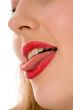 Beautiful woman leaking teeth with tongue close-up