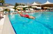 Boy jumping into swimming pool