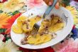 Baked potatoes with meat in plate