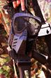 Black military mask hanging on a rifle