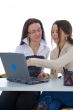 Two business woman work with laptop