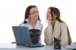 Two business woman work with laptop