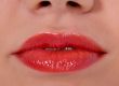 Glamour red gloss lips gesture