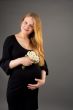 smiling gentle young pregnant blonde woman