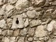 Ancient stone wall with loopholes