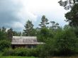  Cottage in the woods. Cloudy day