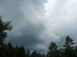  Storm clouds over the forest. Backlight