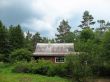  Cottage in the woods. Cloudy day