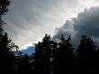  Storm clouds over the forest. Backlight