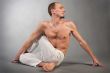 Handsome young man in yoga position