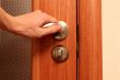 The hand opening a door