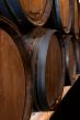 stacked wine barrels in the wine cellar 