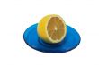 Lemon on a blue saucer.