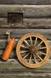 Ceramic Bottle And Spinning Wheel On The Wall