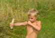 Child with a slingshot.