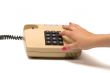 Hand and telephone.