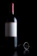 bottle of red wine and corkscrew