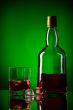 whiskey bottle, ice and glass