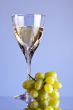 glass of white wine and grape