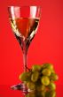 glass of white wine and grape