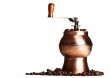vintage coffee grinder standing on beans