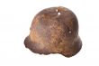 German rusty military helmet on a white