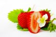 Strawberries and flowers on white background