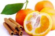orange woth green leaf and cinnamon sticks