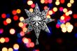 Decorative christmas star - on christmas lichts background..