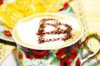 Cappuchino, with chocolate heart and cake