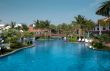 A beautiful large swimming pool at a local resort