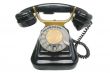 Old vintage black phone with disc dials with cliping path.