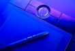 drawing tablet with pen in blue light