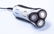 electric shaver on grey background