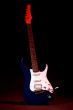 electric guitar in ray of red light