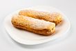 two eclairs on white dish