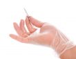 hand in rubber glove holding tweezers