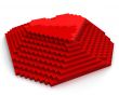Pyramid with heart on top made of red cubic pixels,diagonal view