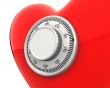 Red heart with a numeric safe lock closeup