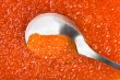 Spoon into red caviar
