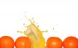Splashing Orange Juice On White
