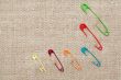 Safety Pins On Canvas