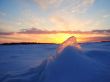 Winter frosen sea sunset and gold ice in Finland